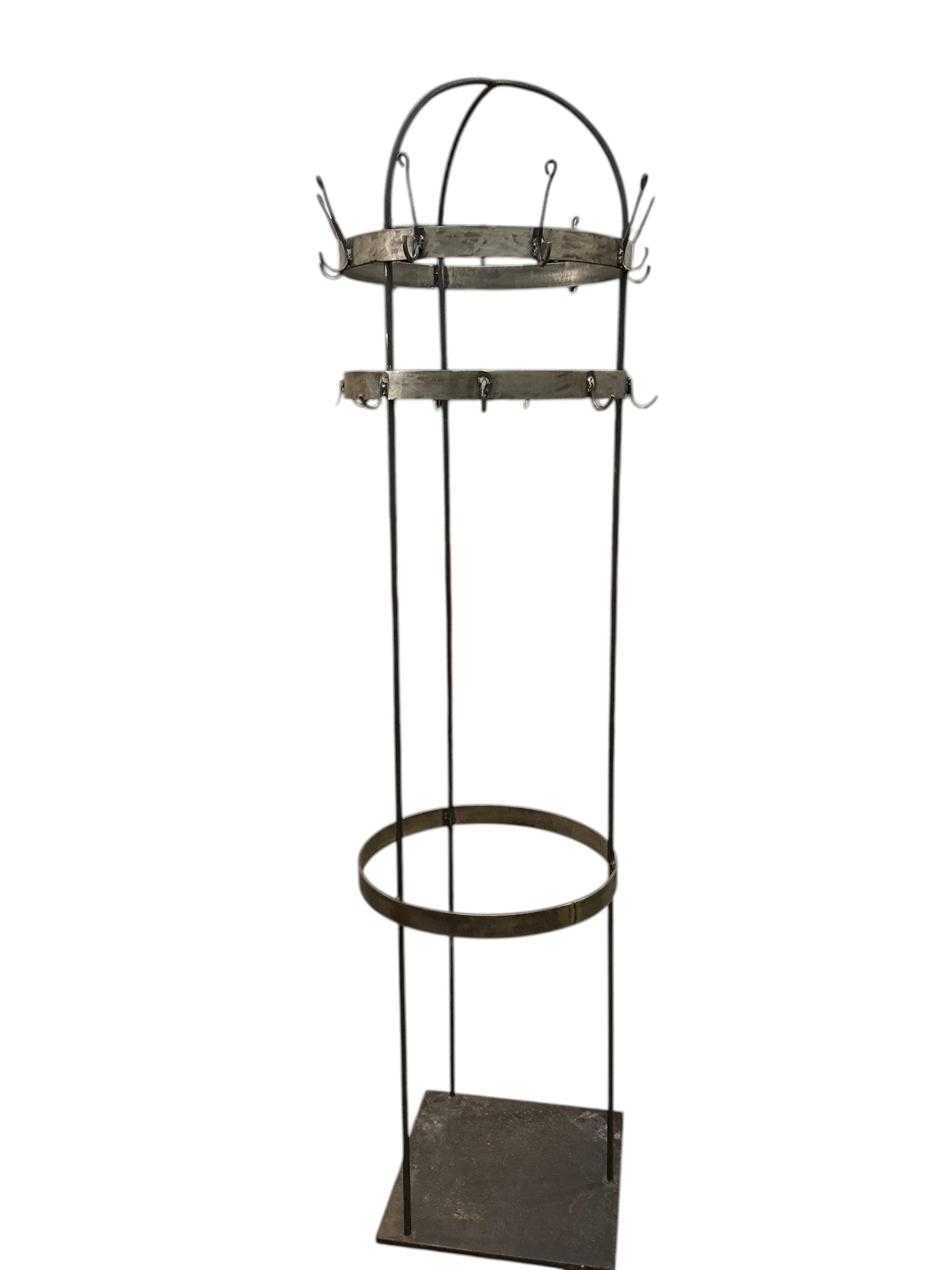 A circular wrought iron hall stand, diameter 45cm, height 184cm
